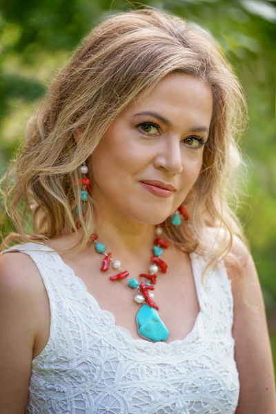 Turquoise Coral Muse jewellery set on a model